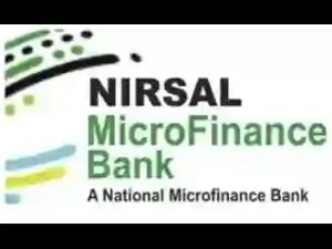 Nigerian small business owner checking NIRSAL loan repayment schedule and loan balance online using a laptop